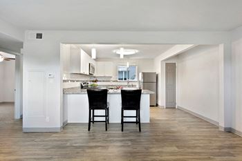 Hardwood flooring in kitchen and bath