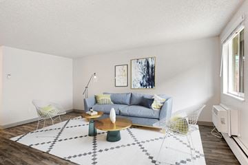 Thornton apartment for rent - A living room with a grey couch and a coffee table.