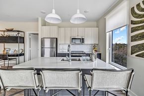 Bridgeport apartment for rent - a kitchen with a large island and chairs