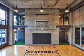 Norwalk apartment for rent - a gym with a basketball hoop and a brick wall