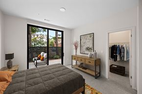 New Haven apartment for rent - a bedroom with a bed and a closet with a dresser at The Audubon New Haven, New Haven, Connecticut