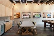 Norwalk apartment for rent - Dining area with a table and chairs and art on the walls  at Iron Works Sono, Connecticut