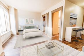 Seattle apartment for rent - a bedroom with a bed and a rug at Zindorf, Seattle, WA