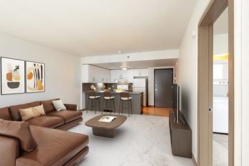 Seattle apartment for rent - A living room with a brown couch and a coffee table.