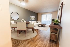 Lakewood apartment for rent - A dining room with a round table and chairs at Bellmary Park Apartments - Kitchen, Living Room, and Deck at Bellamy Park Apartments , Lakewood, 98498