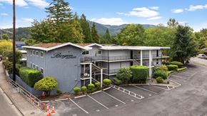 Issaquah apartment for rent - A large building with the word "Beyond" on the side is surrounded by a parking lot.