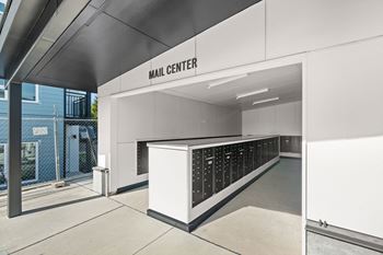 The main entrance to the hall center with a long counter with many bottles of wine
