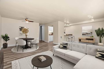 Issaquah apartment for rent - A modern living room with a white couch and a round table.