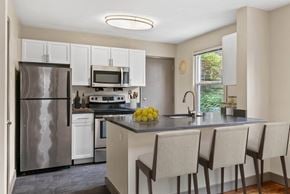 Seattle apartment for rent - A kitchen with a refrigerator, stove, and oven.