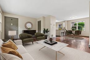 Seattle apartment for rent - A living room with a white couch and a coffee table.