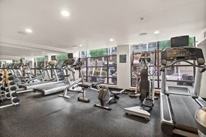 Seattle apartment for rent - A gym with treadmills, exercise bikes, and other equipment.