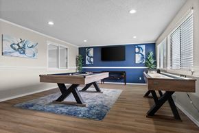 Tacoma apartment for rent - A room with a pool table and a TV mounted on the wall.