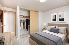 Seattle apartment for rent - A bedroom with a large bed and a wardrobe.