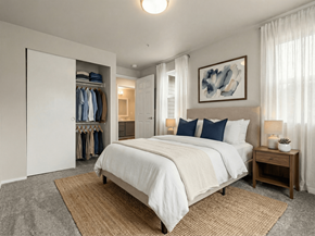Puyallup apartment for rent - A bedroom with a large bed and a wardrobe.