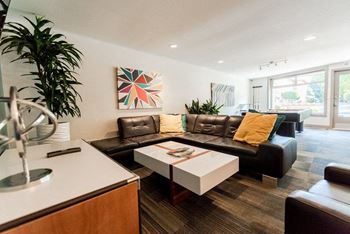A living room with a couch and a table