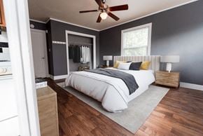 Seattle apartment for rent - a bedroom with a bed and a ceiling fan at Edwards on Fifth, Seattle, WA