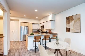 Edmonds apartment for rent - A modern kitchen with a dining table and chairs.