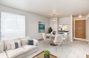 Seattle apartment for rent - A living room with a white couch and a painting on the wall.