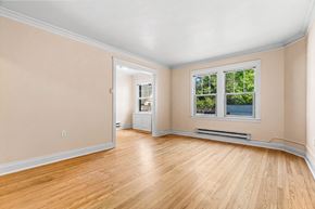 Seattle apartment for rent - A room with a window and a radiator on the wall.