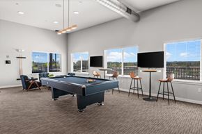 Kent apartment for rent - A room with a pool table and bar stools.