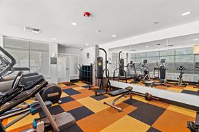 Kent apartment for rent - A gym with a variety of equipment including treadmills, weights, and exercise machines.