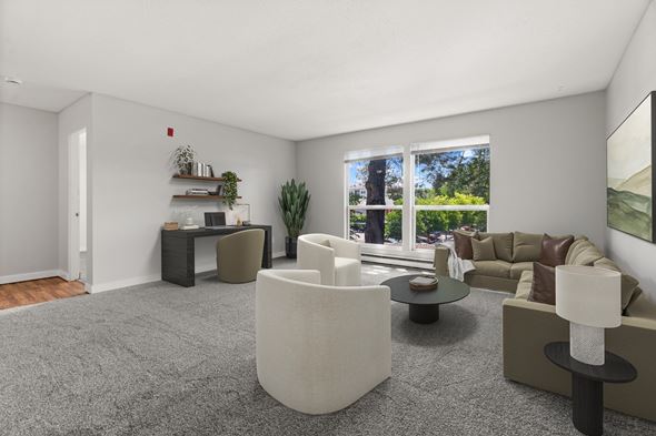 Renton apartment for rent - A living room with a grey carpet and a white sofa.