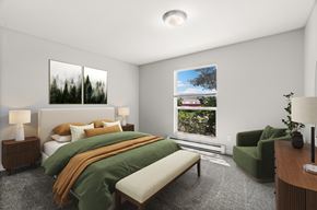 Renton apartment for rent - A bedroom with a large bed and a window showing a view of a house.