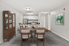 Renton apartment for rent - A dining room with a wooden table and chairs.