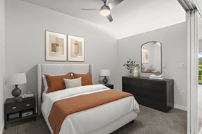 Kent apartment for rent - A bedroom with a large bed and a ceiling fan.