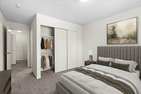 Kent apartment for rent - A bedroom with a large bed and a painting on the wall.