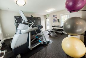 Renton apartment for rent - A gym with a treadmill, exercise balls, and weights. at The Aviator, Renton, Washington