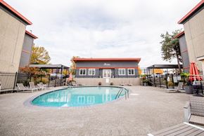 Renton apartment for rent - A small pool in a courtyard surrounded by buildings. at The Aviator, Washington, 98055