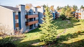 Tacoma apartment for rent - A view of apartment buildings with a green lawn in front. at Northpoint Apartments, Washington, 98407