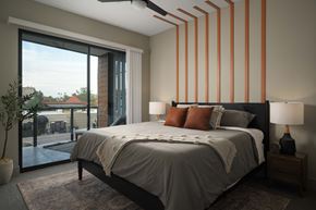 Scottsdale apartment for rent - A bedroom with a large bed and a ceiling fan.