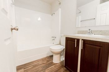 A bathroom with a toilet and a sink