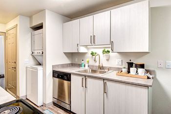 Kitchen with stainless steel appliances and white cabinets