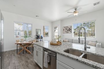 Mesa apartment for rent - A modern kitchen with a dining table and a ceiling fan.
