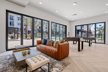 Avondale apartment for rent - A modern living room with a brown leather sofa and a coffee table.