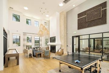 Phoenix apartment for rent - A ping pong table is in the middle of a living room.