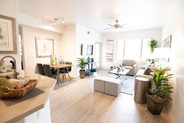 Phoenix apartment for rent - A living room with a dining table and chairs.