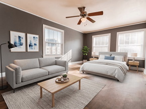 Seattle apartment for rent - A bedroom with a large bed, a couch, a coffee table, and a ceiling fan.