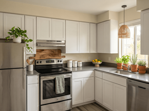 Issaquah apartment for rent - A kitchen with white cabinets and a black stove top oven.