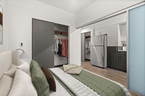 Seattle apartment for rent - A bedroom with a bed and a wardrobe.