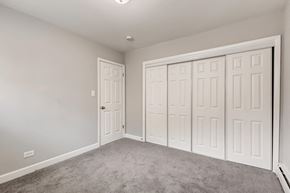 Arlington Heights apartment for rent - A room with a grey carpet and white walls.