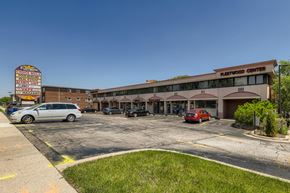 Palatine apartment for rent - a parking lot in front of a shopping center with a building