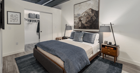 Glendale apartment for rent - a bedroom with a bed and a painting on the wall