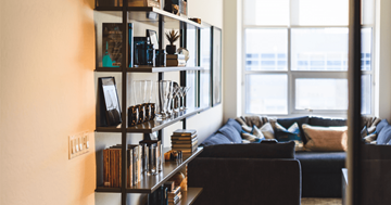 Glendale apartment for rent - a living room with bookshelves and a black couch