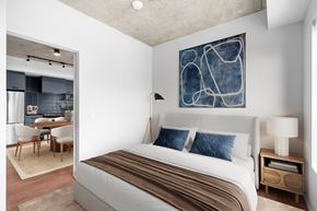 Calgary apartment for rent - Suite 2502 - A bedroom with a large bed and a painting on the wall.