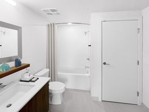 Calgary apartment for rent - a bathroom with a shower and a sink and a toilet
