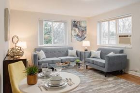 Greenbelt apartment for rent - A dining room with a round table set for two.